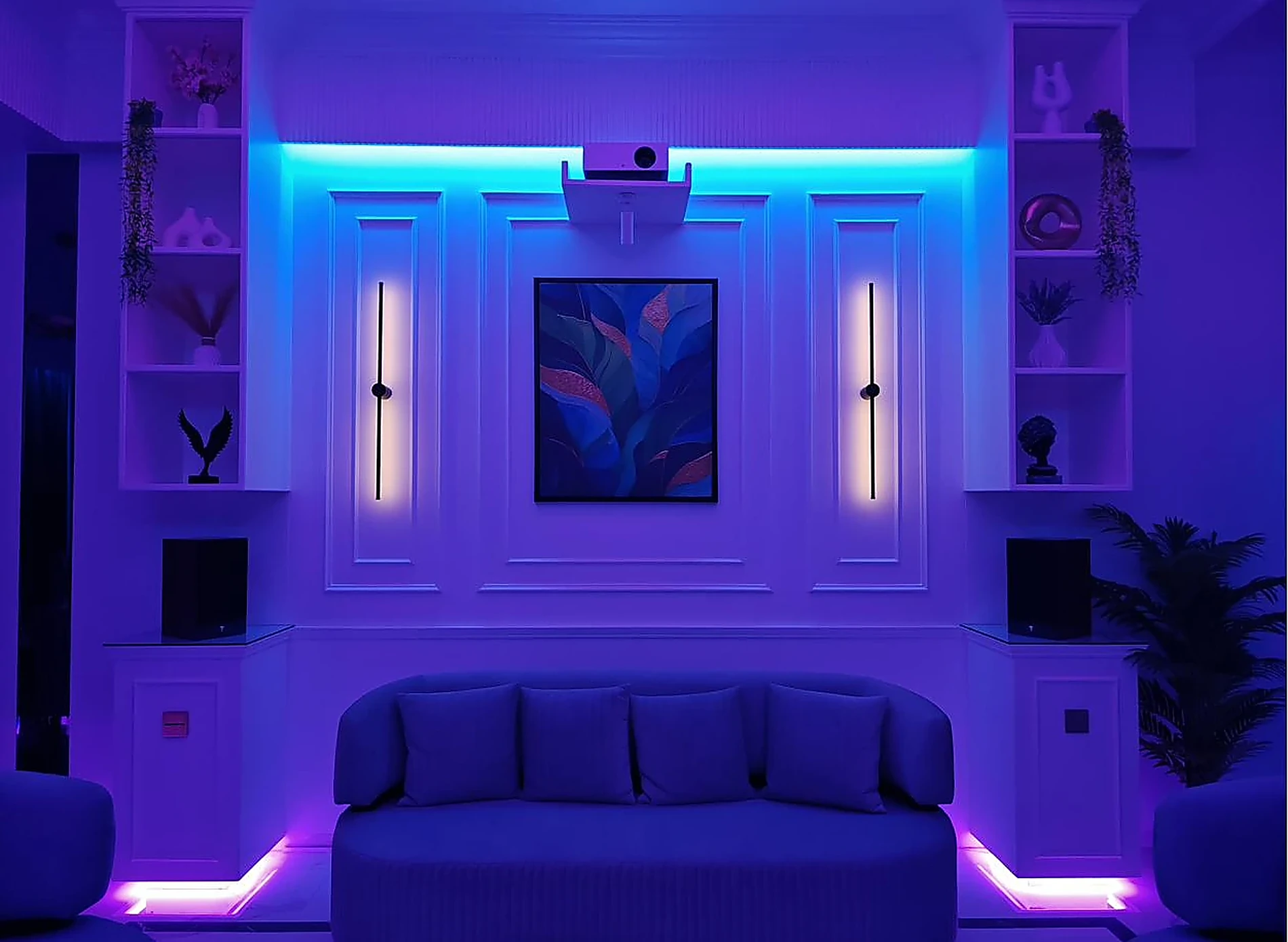 The same wall under blue and violet colour light across coves and plinths