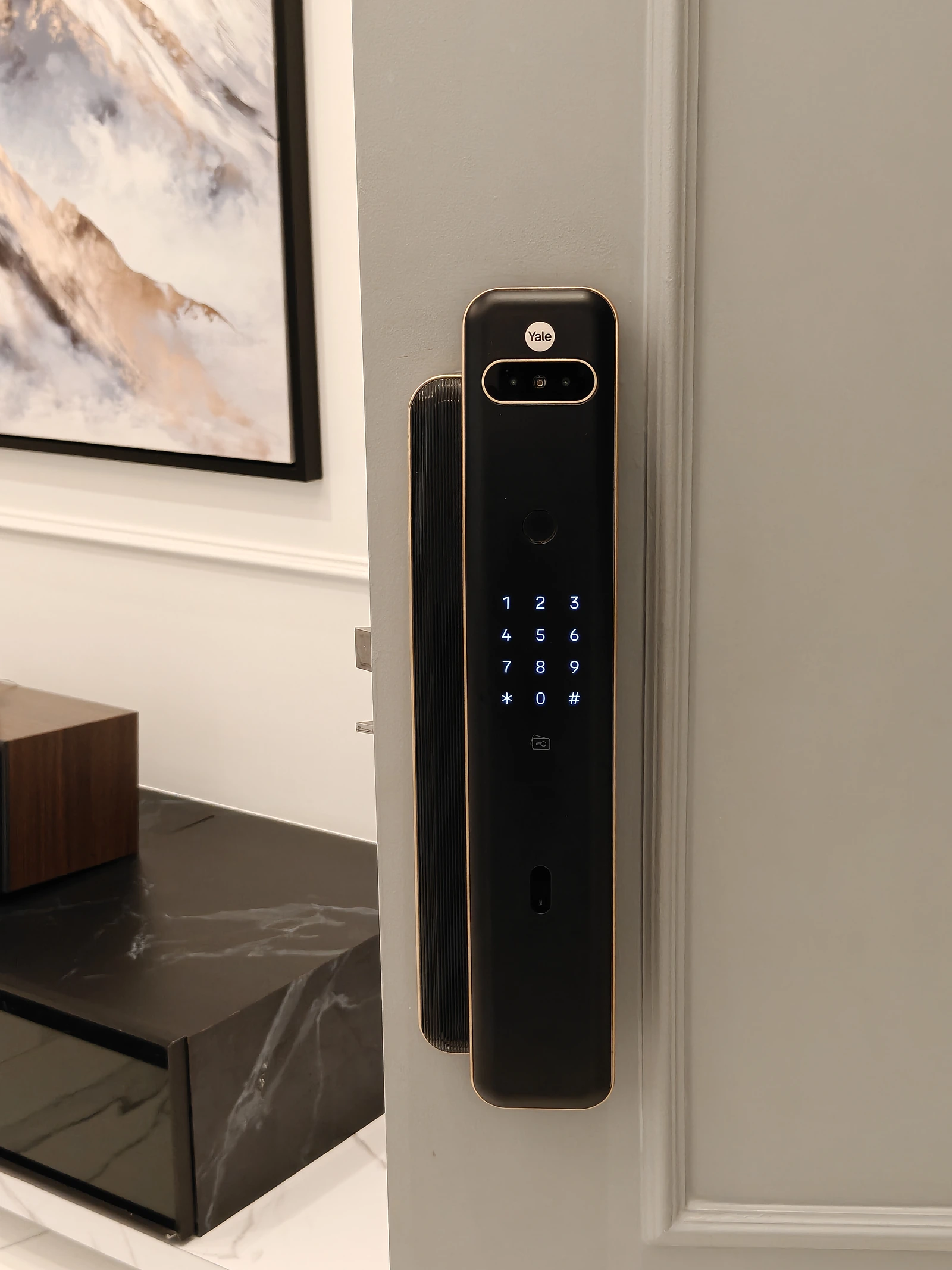 Yale smart lock with fingerprint reader, keypad and camera on a residential door